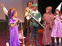 Children performing a play on stage