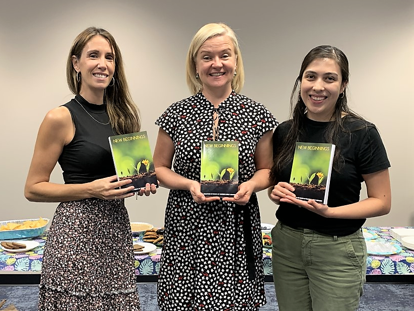 Three women holding copies of the New Beginnings book