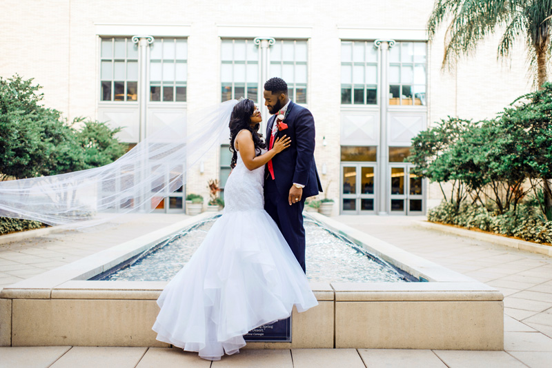 wedding party in front of the fountain at the Main library