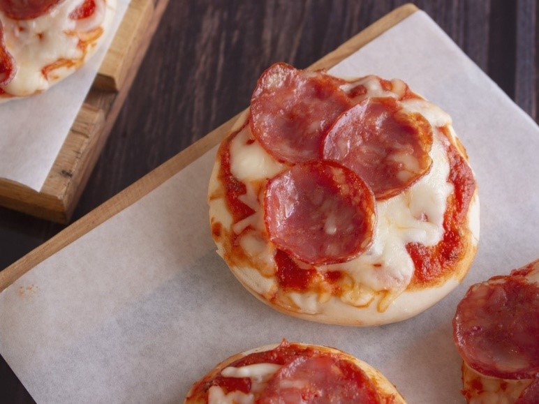 Homemade miniature pizzas with pepperoni