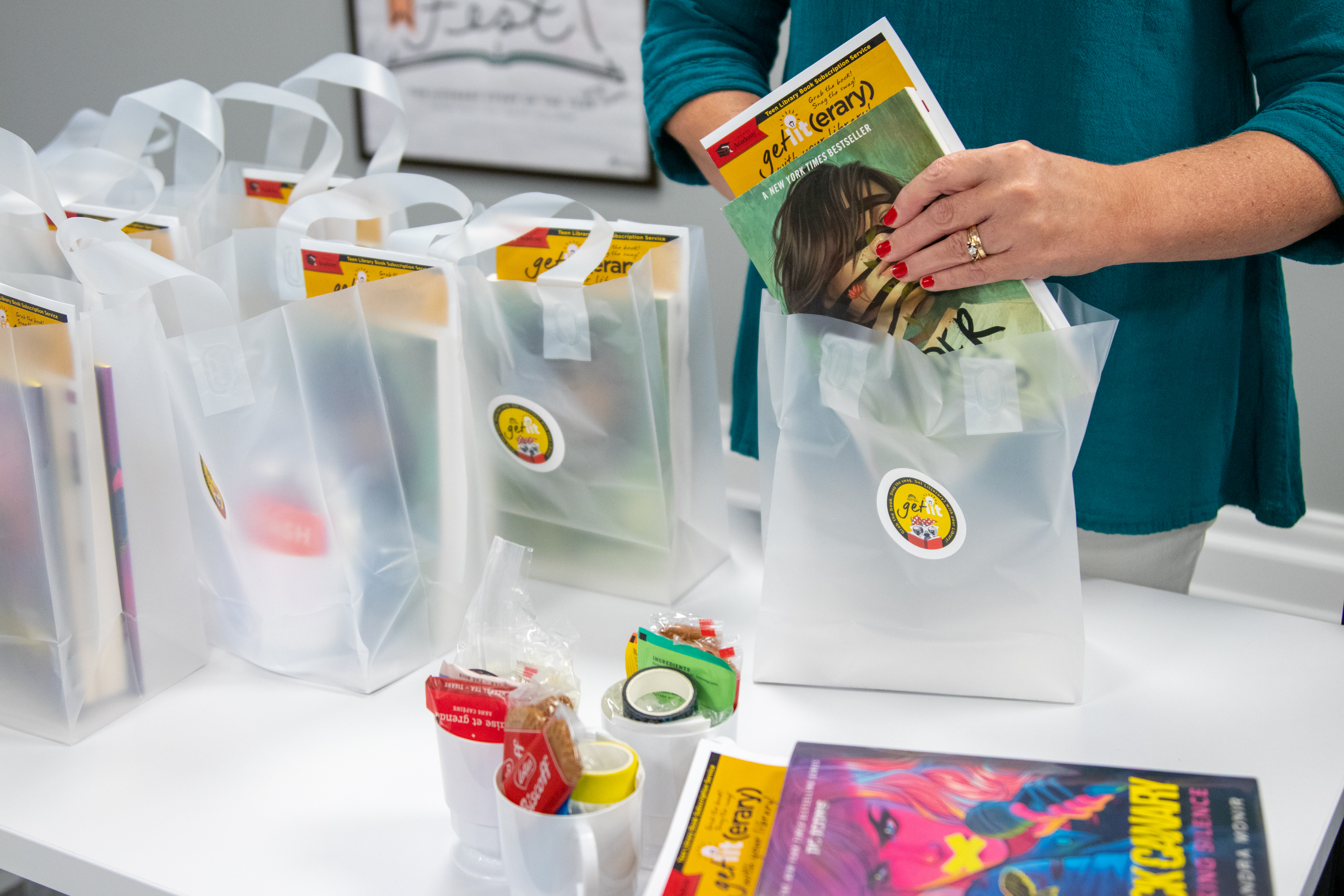 photo of staff member filling a swag bag