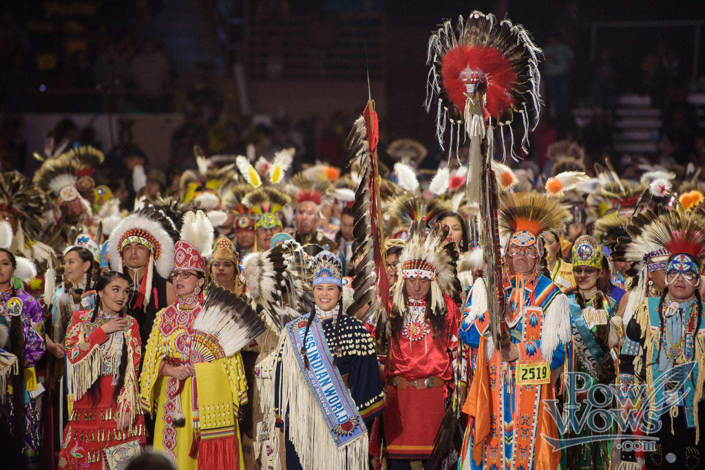 Large group of Native Americans in traditional garb