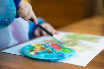 Child painting on paper