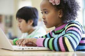 Young African American Girl Using a Laptop