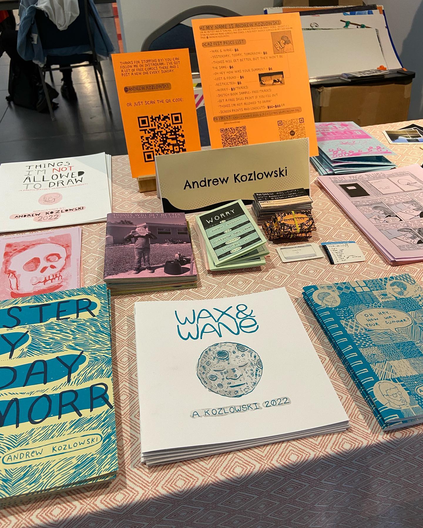 tabletop of zines at DCAZ Fest 2022