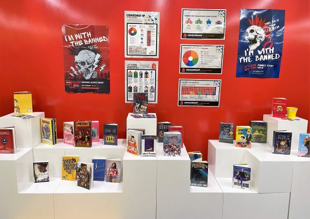 Banned Books Week display in the Teen Room at Main Library with infographic posters