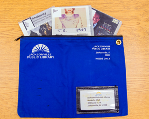 Library Books by Mail pouch with items for mailing