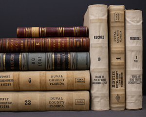City Hall Historic Records Collection image of stacked books found in the City Hall Historic Records Collection at the Library