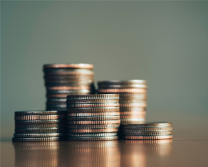 stacked coins representing library fines and fees