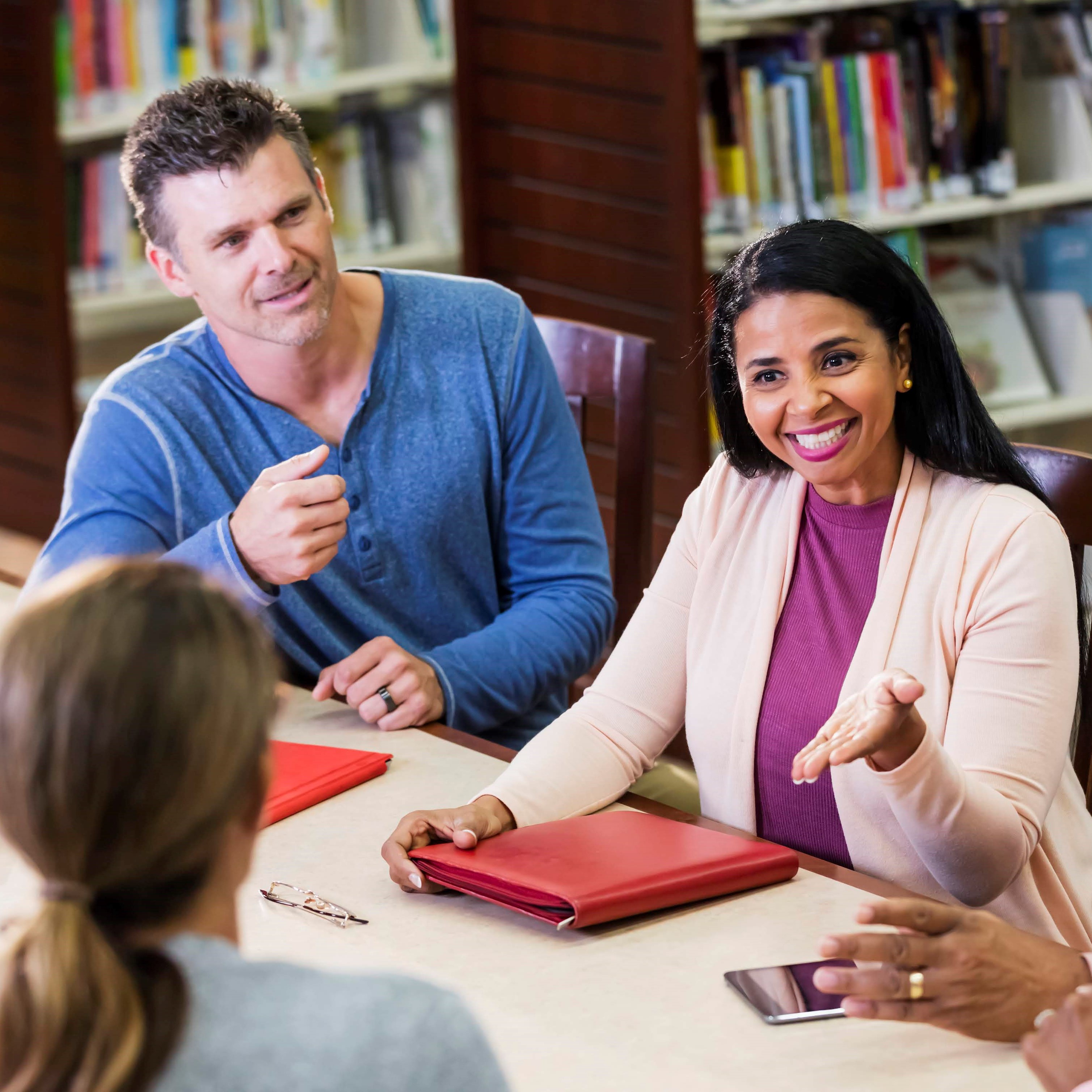 A group of adults meeting around a table