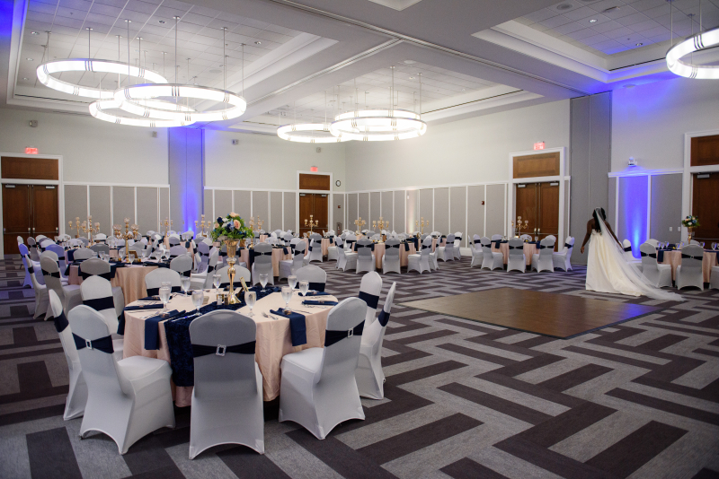 photo of a bride in a room decorated for a wedding reception