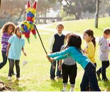 Children breaking a pinata