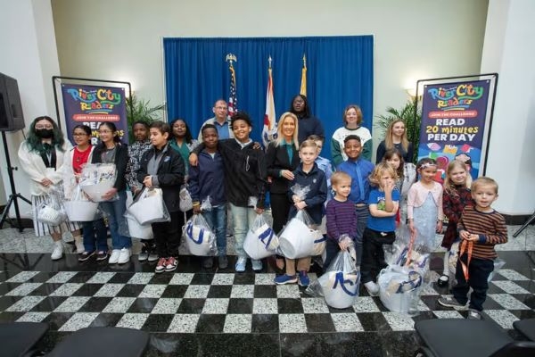 Mayor Deegan with the city's top readers from 2024