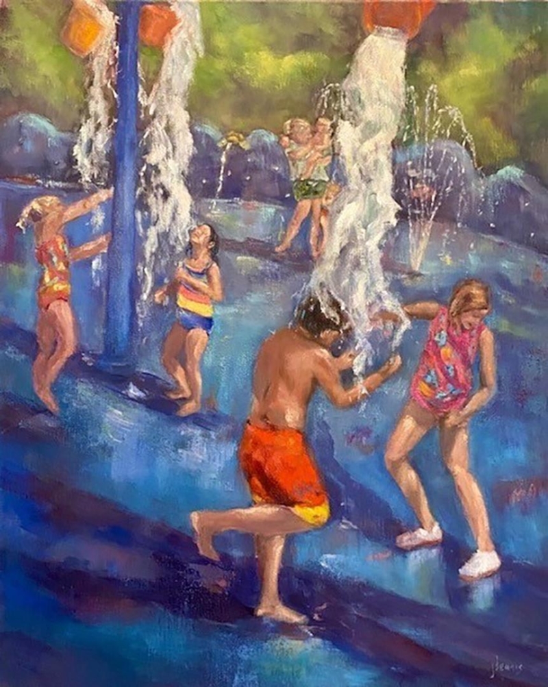 Til the bucket tips - children playing with a water park feature