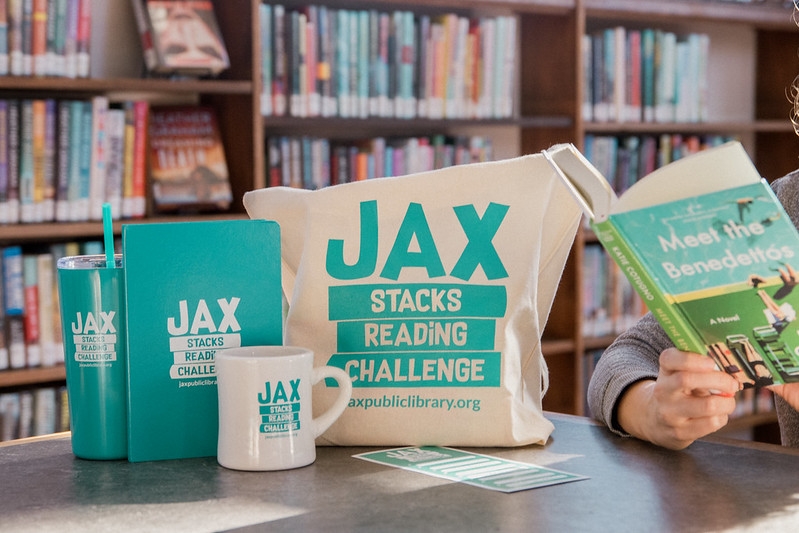 Jax Stacks branded prizes including a tote, mug, tumbler and journal.