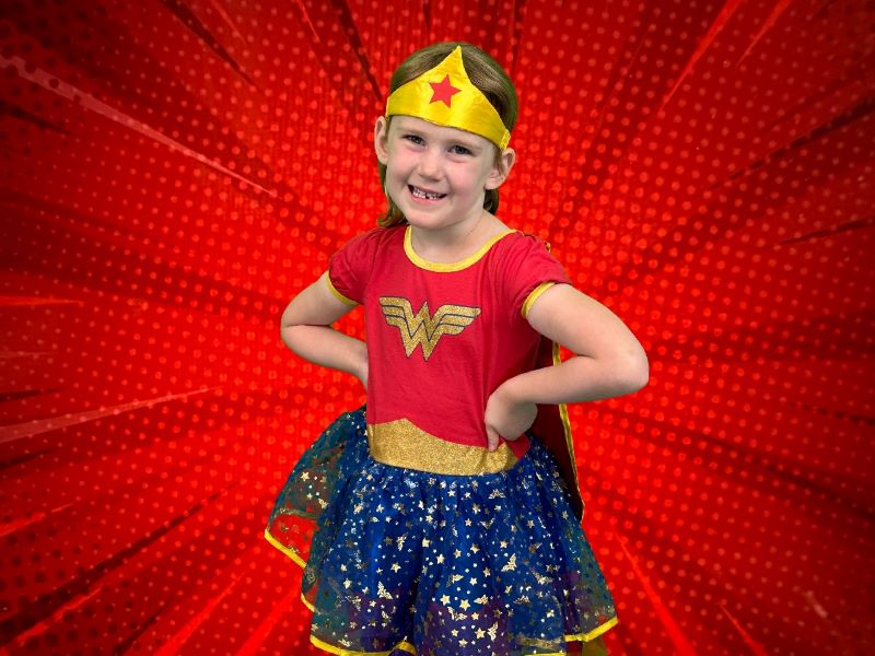 Photo of a young girl dressed as Wonder Woman.