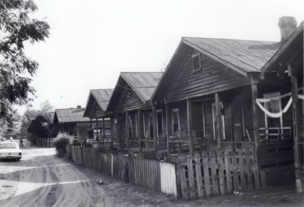 Historic photo of a row of houses in Mixon Town