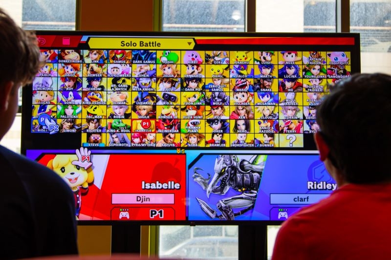 Smash Brothers characters on a big screen.