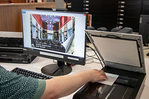 Person scanning an image at the Library's scanning station