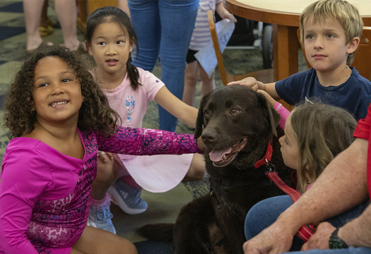 Elementary, Middle, and High School Field Trips children with dog at a library