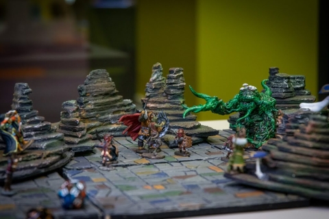 Some hand-crafted dungeon tiles, cave accents and painted miniatures