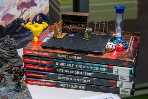 Dungeons & Dragons books, dice, and game board accents