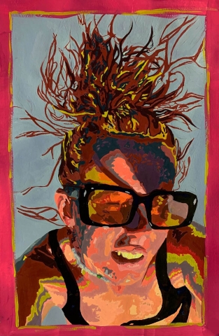 A girl in sunglasses with wild hair