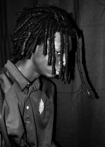 Photo of a young black man with dreadlocks