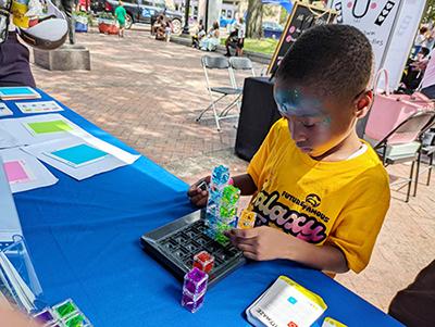 Young boy at Library outreach table