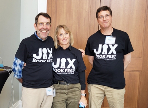 two men and a woman volunteering for Jax Book Fest