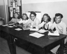 Image of African American students sitting at a table at New Stanton HIgh School