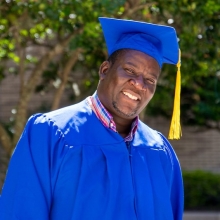 Samuel Phiri in a cap and gown