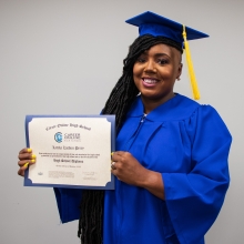 Lateka Perry in cap and gown with diploma