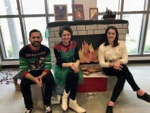 Hurley, Jenna and Bryan sitting next to a fake fire book display