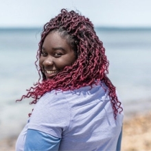 Photo of Jasmin Graham on a beach