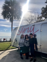 Jenna and Hurley with Jacqueline Van Meter in front of the StoryCorps bus