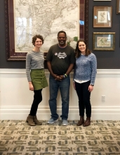 Jenna and hurley smiling with william jackson in the ansbacher map room at jacksonville public library