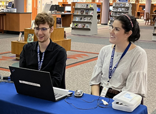 man and woman volunteering at a library